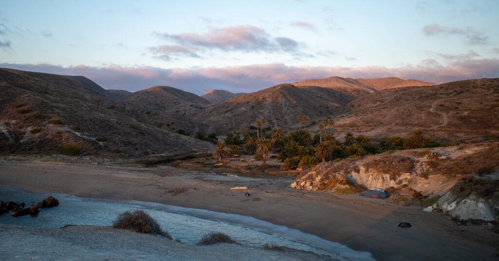 Sunset over Little Harbor Campground from a large rock