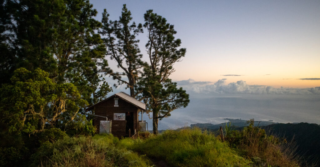 Sunrise behind Fare Mato hut on the Mont Aorai trek