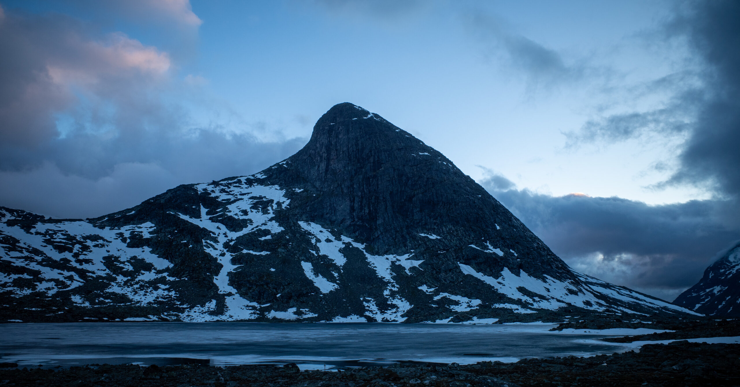Mjølkedalstinden above a frozen lake near the second campsite