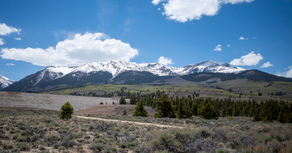 Snow-covered Sawatch Range above a dirt road near Twin Lakes