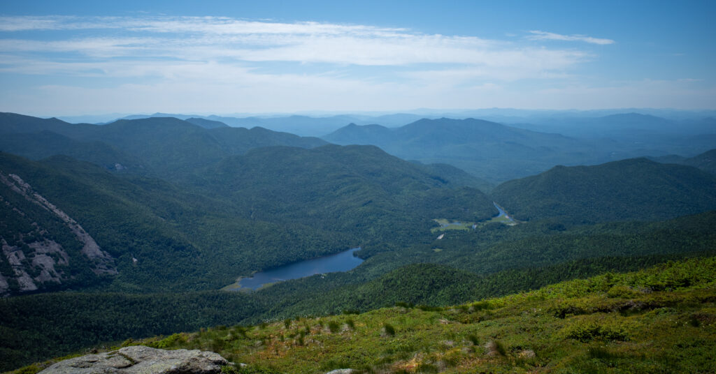 Lake Colden and the Flowed Lands seen from Algonquin Peak beneath layered Adirondack ridges