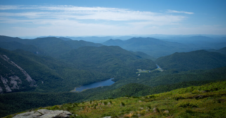 Lake Colden and the Flowed Lands seen from Algonquin Peak beneath layered Adirondack ridges