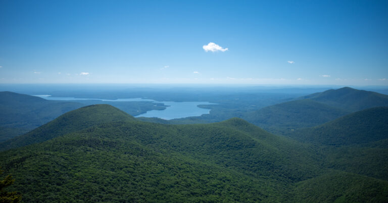 Ashokan Reservoir beyond forested Catskill ridges from Wittenberg Mountain