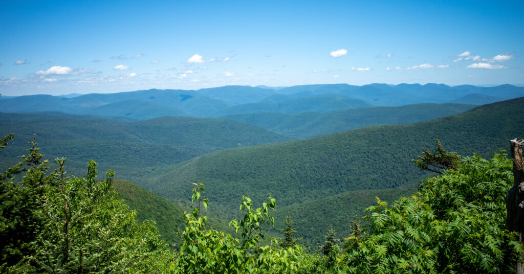 Forested Catskill ridges and valley from the climb toward Slide Mountain