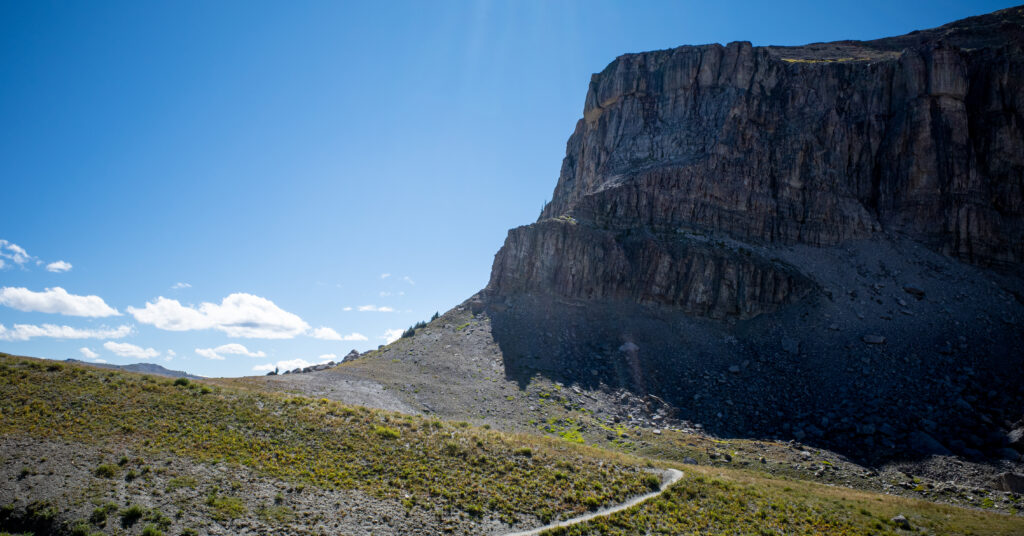 Trail beneath the cliffs of Death Canyon Shelf on the descent toward Alaska Basin